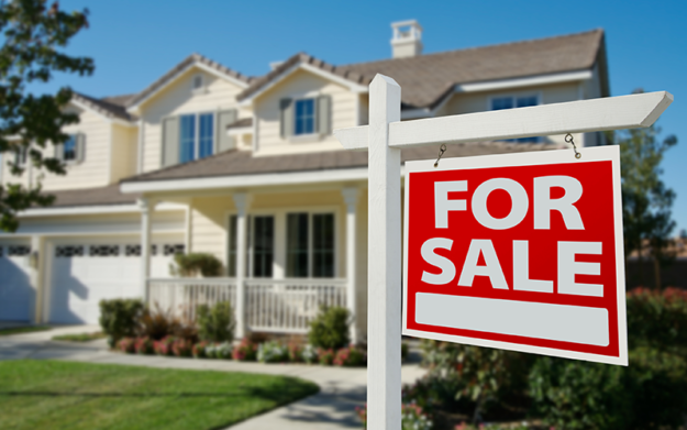 A for sale sign in front of a house letting you know that Laywer attorney Shane Zisman
