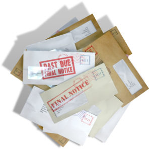 A scattered stack of envelopes with a notice saying payment due, symbolizing bills and debt—consider Chapter 7 bankruptcy in Iowa